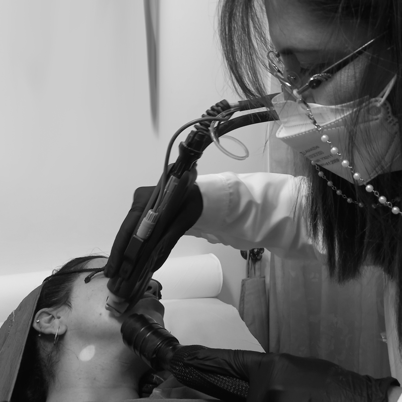 Dr Sarah performing laser hair removal treatment